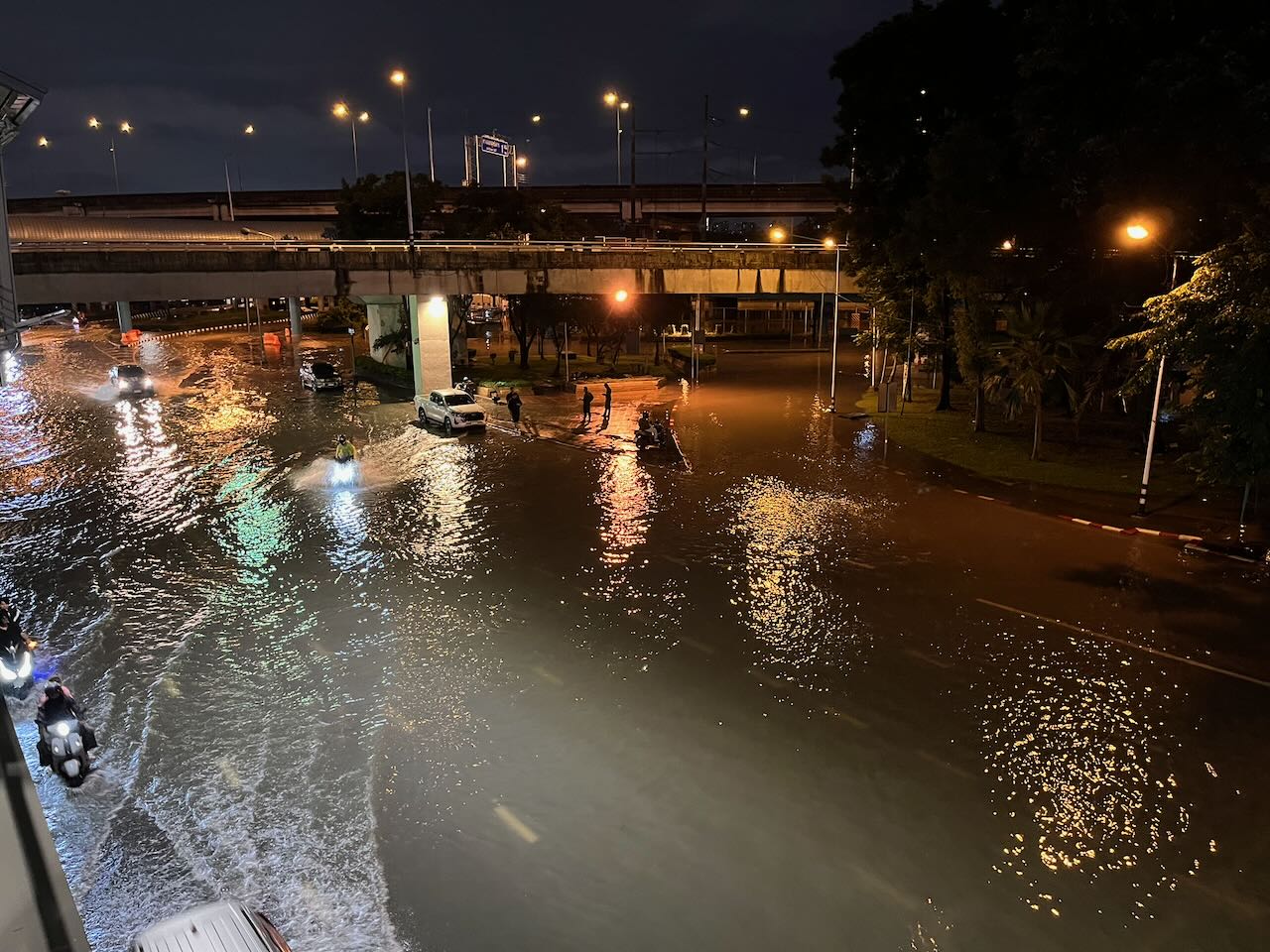 Flooded streets at night in Chatuchak district, Bangkok Thailand